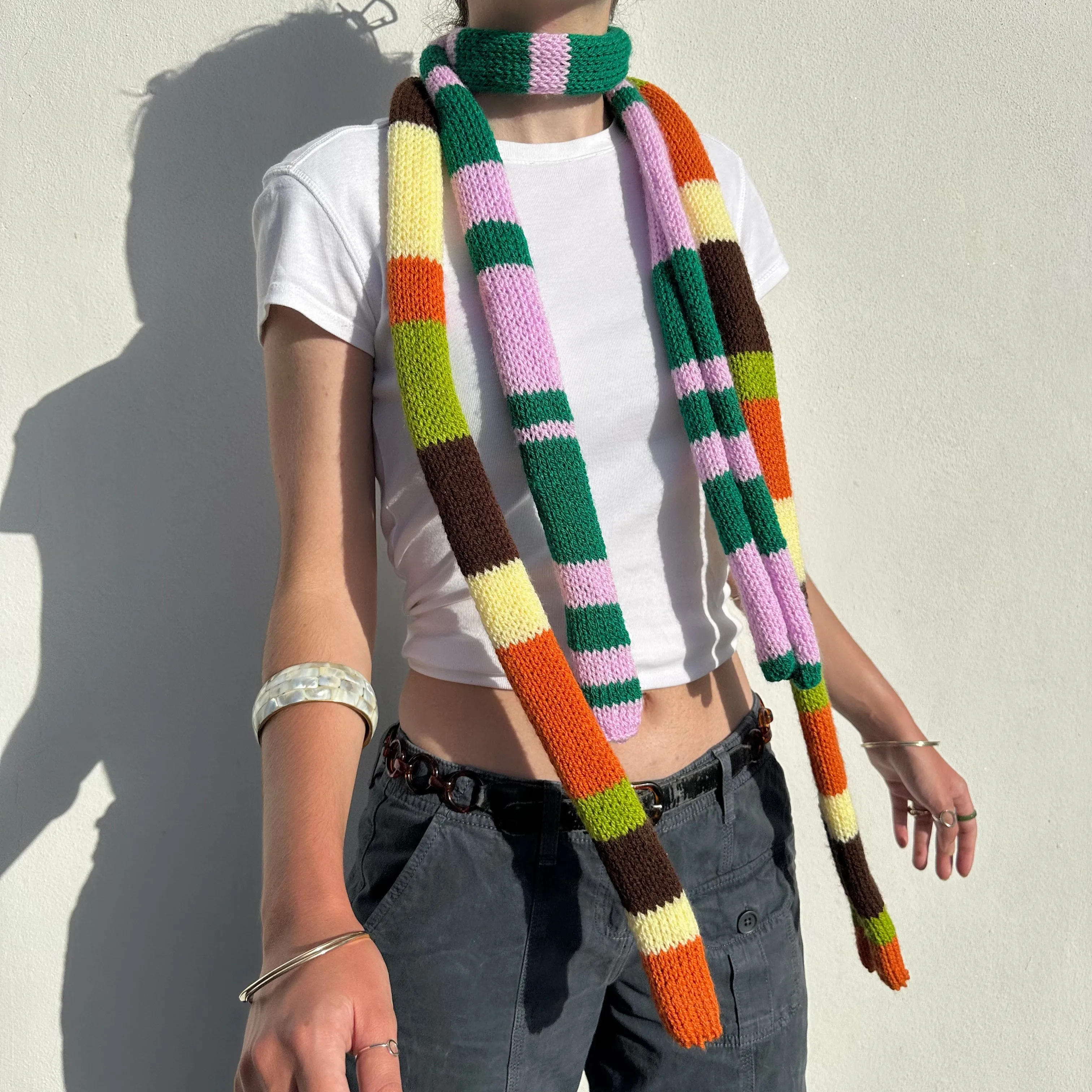 Handmade knitted stripy skinny scarf in baby pink and green