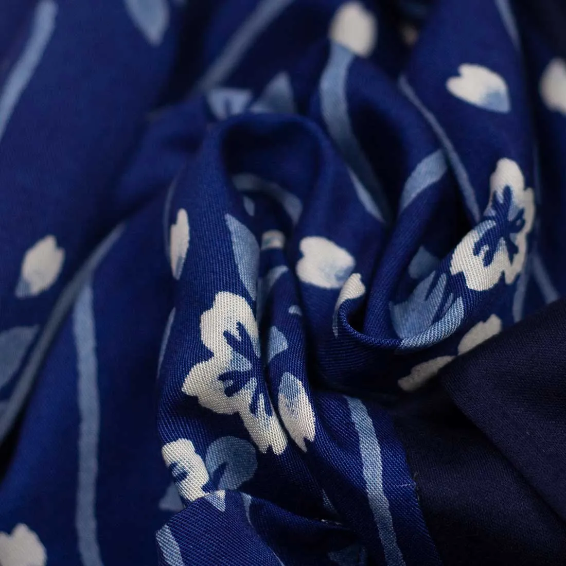 Reversible indigo cotton and lyocell kimono jacket with "flower raft" bassen relief print